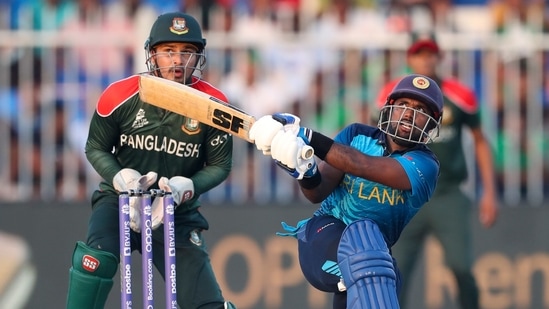 Sri Lanka's Charith Asalanka hits the ball for four runs during the Cricket Twenty20 World Cup match between Sri Lanka and Bangladesh in Sharjah, UAE, Sunday