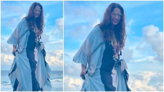Bipasha Basu matched her outfit with the shades of the clouds, the sky and the beautiful blue sea.(Instagram/@bipashabasusinghgrover)