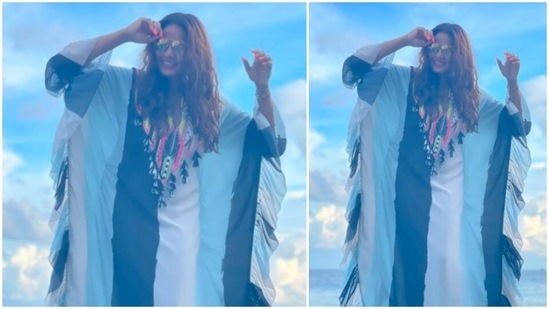 Bipasha Basu accessorised her beach look with nothing but just a pair of big shades.(Instagram/@bipashabasusinghgrover)