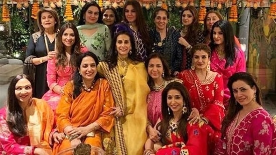 Here are some of the Bollywood celebrities and star wives at a Karwa Chauth celebration. Sunita Kapoor is in yellow, Raveena Tandon in red, Neelam in pink and Rima Jain at the back.