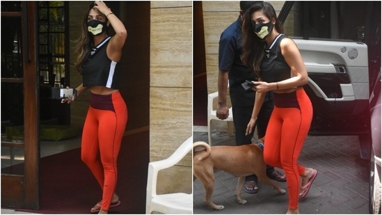 Malaika teamed her ensemble with a printed black face mask and flip flops. She left her locks open in a side-parted style and opted for a bare face to complete the look.(Ht Photo/Varinder Chawla)