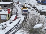 Vehicles get enveloped in snow as fresh snowfall continues, at Khoksar, in Lahaulspiti. Vehicles get enveloped in snow as fresh snowfall continues, at Khoksar, in Lahaulspiti.