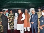 Union home minister Amit Shah interacts with BSF soldiers on Sunday.