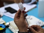 A health worker prepares a dose of the Covaxin Covid-19 vaccine at a vaccination center set up at a Delhi government health dispensary in New Delhi, India. (Bloomberg) A health worker prepares a dose of the Covaxin Covid-19 vaccine at a vaccination center set up at a Delhi government health dispensary in New Delhi, India. (Bloomberg)