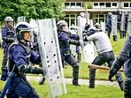 Police officers take part in a public order training session in preparation for COP26 in Glasgow on August 30. About 10,000 officers from around the UK will be deployed each day of the summit, making it one of the largest policing operations ever undertaken in Britain. AFP/FILE Police officers take part in a public order training session in preparation for COP26 in Glasgow on August 30. About 10,000 officers from around the UK will be deployed each day of the summit, making it one of the largest policing operations ever undertaken in Britain. AFP/FILE