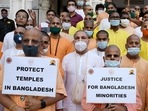 ISKON priests hold placards during a protest against violence in Bangladesh.(ANI File Photo) ISKON priests hold placards during a protest against violence in Bangladesh.(ANI File Photo)