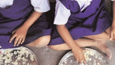Teachers in Chhattisgarh village walk 8 km every day carrying ration to ensure mid-day meal in govt school (AFP)