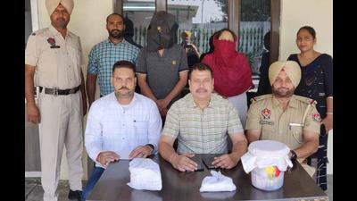 The drug accused and his female aide in Ludhiana police custody on Monday. (HT Photo) The drug accused and his female aide in Ludhiana police custody on Monday. (HT Photo)