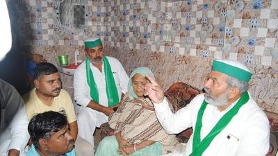 BKU leader Rakesh Tikait meeting family members of sanitation worker who died in police custody in Agra. (HT photo) BKU leader Rakesh Tikait meeting family members of sanitation worker who died in police custody in Agra. (HT photo)