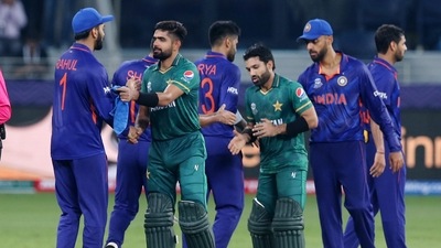 Pakistan's Mohammad Rizwan and Babar Azam shake hands with the India players after the match. (REUTERS)