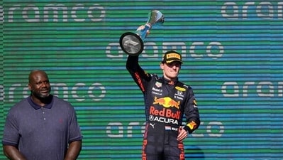 Max Verstappen (R) of the Netherlands holds up the winner's trophy as Shaquille O'Neal looks on at the Formula One U.S. Grand Prix at Circuit of the Americas. (AP) Max Verstappen (R) of the Netherlands holds up the winner's trophy as Shaquille O'Neal looks on at the Formula One U.S. Grand Prix at Circuit of the Americas. (AP)