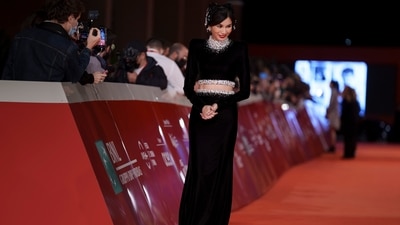 The beauty teamed her ethereal ensemble with a sparkling headpiece which was full of even more diamantes. She tied her tresses in a sleek side-parted ponytail and combined the look with minimal make-up featuring red lips and winged eyeliner. (AP) The beauty teamed her ethereal ensemble with a sparkling headpiece which was full of even more diamantes. She tied her tresses in a sleek side-parted ponytail and combined the look with minimal make-up featuring red lips and winged eyeliner. (AP)