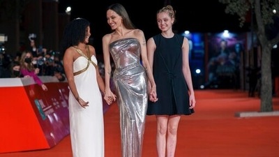 Angelina Jolie attended the Eternals premiere with daughters Shiloh Jolie-Pitt (R) and Zahara Jolie-Pitt. Oct. 24, 2021. (AP Photo/Domenico Stinellis) (AP) Angelina Jolie attended the Eternals premiere with daughters Shiloh Jolie-Pitt (R) and Zahara Jolie-Pitt. Oct. 24, 2021. (AP Photo/Domenico Stinellis) (AP)