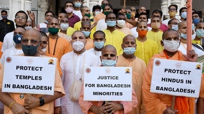 ISKON priests hold placards during a protest against violence in Bangladesh. (ANI File Photo) ISKON priests hold placards during a protest against violence in Bangladesh. (ANI File Photo)