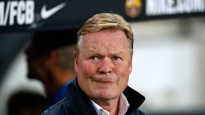 The fans gathered around Ronald Koeman's car and shouted insults at the Barcelona manager. (REUTERS)