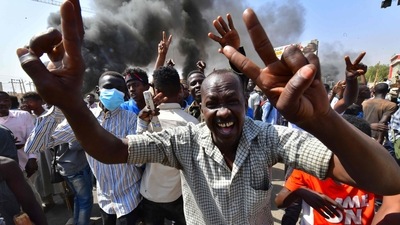Sudanese people protest against a military coup that overthrew the transition to civilian rule. (AFP)