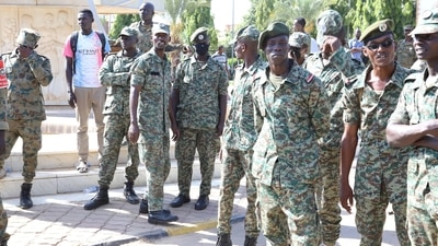 Sudanese military stand guard in front of the presidential palace in Khartoum. (Reuters File Photo)