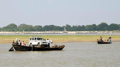 A file photo of a boat carrying a four-wheeler down the Ganga river at Danapur Ghat in Patna, Bihar. The Chhath festival will celebrated across Bihar starting on November 8, 2021. (Santosh Kumar/ HT)
