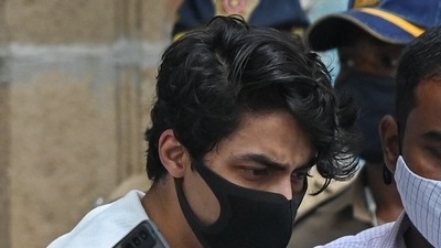 Aryan Khan being escorted to court by Narcotics Control Bureau (NCB) officials. (AFP) Aryan Khan being escorted to court by Narcotics Control Bureau (NCB) officials. (AFP)
