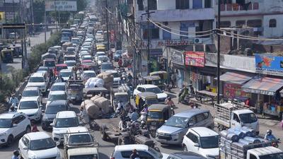 Commuters stuck in a traffic jam at Samarla Chowk as protesters blocked the road for eight hours on Monday. (Gurpreet Singh/HT)