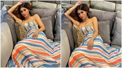 A corset-styled torso and pleated tulle skirt accentuated Mouni's ensemble. We also loved the asymmetric hemline of her maxi-length dress. The actor looked absolutely dreamy in the summer dress, and you should include this look in your collection. (Instagram/@imouniroy)