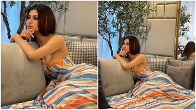 Mouni styled the printed maxi with just a diamond ring and centre-parted open tresses. Winged eyeliner, mascara-laden lashes, blushed cheeks, nude lip shade, glowing skin, and filled eyebrows completed the star's glam. (Instagram/@imouniroy)