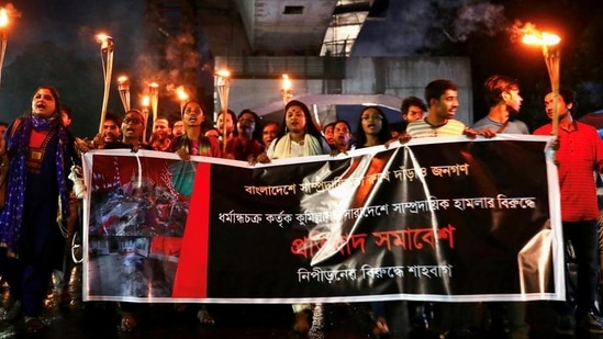 Bangladeshi activists join in a torch procession demanding justice for the violence against Hindus during Durga Puja festival, Dhaka, Bangladesh, October 18, 2021. (REUTERS) Bangladeshi activists join in a torch procession demanding justice for the violence against Hindus during Durga Puja festival, Dhaka, Bangladesh, October 18, 2021. (REUTERS)
