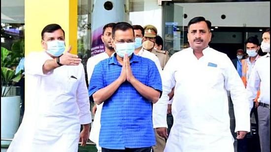 Delhi chief minister Arvind Kejrwail greets people at the Lucknow airport. (ANI Photo)