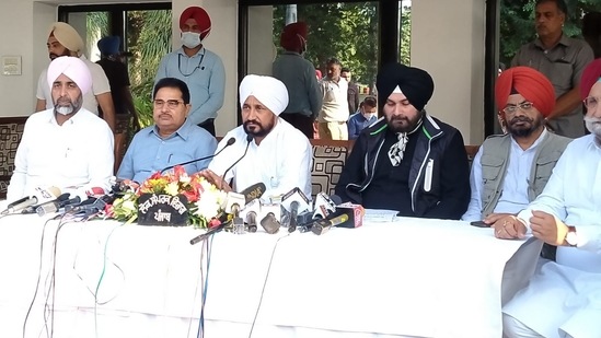 Punjab CM Charanjit Singh Channi (centre) along with state Congress chief Navjot Singh Sidhu. (HT Photo)