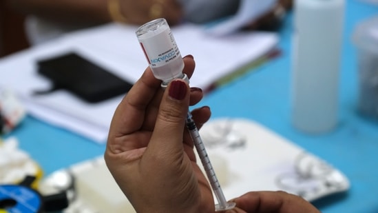 A health worker prepares a dose of the Covaxin Covid-19 vaccine at a vaccination center set up at a Delhi government health dispensary in New Delhi, India. (Bloomberg) A health worker prepares a dose of the Covaxin Covid-19 vaccine at a vaccination center set up at a Delhi government health dispensary in New Delhi, India. (Bloomberg)