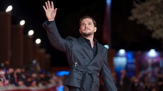 Actor Kit Harington was also present at the event. He attended the premiere in a greyish-black structured suit featuring a double-breasted blazer with distinctive buckles, flared pants, and dress shoes. The Game Of Thrones star completed his look with a trimmed beard and sleek hairdo.(AP)