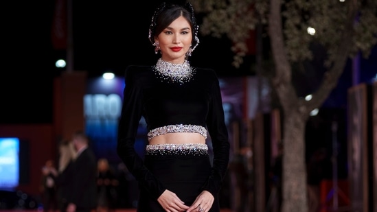 Gemma Chan wore a black embellished two-piece gown, flashing a peek of her washboard abs in the stylish number. The ensemble came with diamantes adorned on the neckline and bust of her crop top. The waistline of her skirt also featured similar embellishments.(AP)