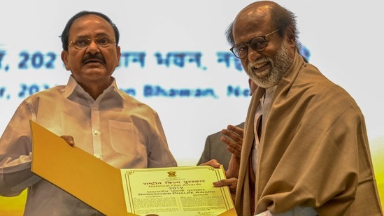 Actor Rajinikanth received the Dadasaheb Phalke Award from Vice President Venkaiah Naidu, during the 67th National Film Awards and Dadasaheb Phalke Awards 2019 held in New Delhi. (AFP)