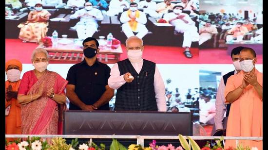 Prime Minister Narendra Modi launches the Ayushman Bharat Health Infrastructure Mission, in Varanasi on Monday. UP governor Anandiben Patel and chief minister Yogi Adityanath are also seen. (ANI Photo)