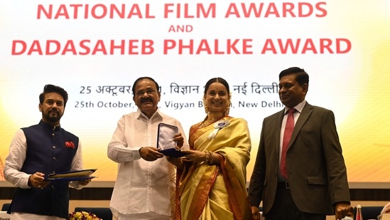 Actor Kangana Ranaut receives the Best Actress award from Vice-President Venkaiah Naidu during the 67th National Film Awards and Dadasaheb Phalke Awards 2019. (AFP)