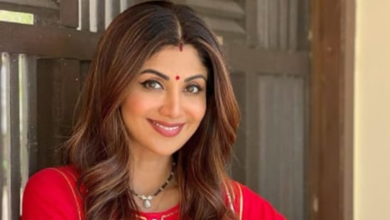 Shilpa Shetty shared her picture on Instagram wearing an embroidered red suit as she smiled for the camera.