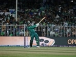 Pakistan's Asif Ali hits a six during the Cricket Twenty20 World Cup match between New Zealand and Pakistan in Sharjah, UAE, Tuesday, Oct. 26, 2021. (AP Photo/Aijaz Rahi)(AP)