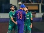Indian cricket captain Virat Kohli congratulates Pakistan's Mohammad Rizwan, right, and Babar Azam after Pakistan won the Cricket Twenty20 World Cup match between India and Pakistan in Dubai(AP) Indian cricket captain Virat Kohli congratulates Pakistan's Mohammad Rizwan, right, and Babar Azam after Pakistan won the Cricket Twenty20 World Cup match between India and Pakistan in Dubai(AP)