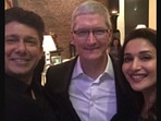 The image shows Shriram Nene and Madhuri Dixit with Tim Cook.