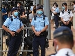 Police officers standing guard outside a court in Hong Kong in July, after the first sentencing under the National Security Law.&nbsp;