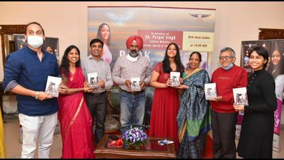 Punjab minister Pargat Singh releasing the book penned by Khushi Sharma (centre) in Chandigarh on Tuesday. (HT)