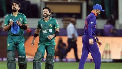 Pakistan skipper Babar Azam and Mohammad Rizwan walk after being congratulated by India's captain Virat Kohli on their victory in the ICC men's Twenty20 World Cup cricket match against India, at the Dubai International Cricket Stadium, in Dubai on Sunday. (ANI ) Pakistan skipper Babar Azam and Mohammad Rizwan walk after being congratulated by India's captain Virat Kohli on their victory in the ICC men's Twenty20 World Cup cricket match against India, at the Dubai International Cricket Stadium, in Dubai on Sunday. (ANI )