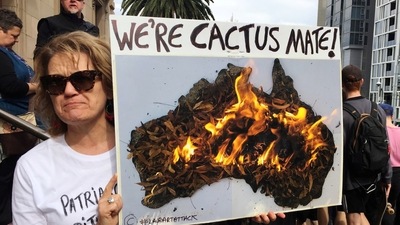 A woman holds up a sign as she takes part in a protest to call for action on climate change in Melbourne, Australia.&nbsp; (File Photo / REUTERS)