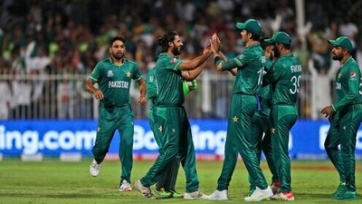 Pakistan's Imad Wasim, without cap, celebrates with teammates after the dismissal of New Zealand's Daryl Mitchell during the Cricket Twenty20 World Cup match between New Zealand and Pakistan in Sharjah, UAE, Tuesday, Oct. 26, 2021. (AP Photo/Aijaz Rahi) (AP) Pakistan's Imad Wasim, without cap, celebrates with teammates after the dismissal of New Zealand's Daryl Mitchell during the Cricket Twenty20 World Cup match between New Zealand and Pakistan in Sharjah, UAE, Tuesday, Oct. 26, 2021. (AP Photo/Aijaz Rahi) (AP)