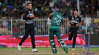 New Zealand's Tim Southee, left. Celebrates the dismissal of Pakistan's captain Babar Azam during the Cricket Twenty20 World Cup match between New Zealand and Pakistan in Sharjah, UAE, Tuesday, Oct. 26, 2021. (AP Photo/Aijaz Rahi) (AP) New Zealand's Tim Southee, left. Celebrates the dismissal of Pakistan's captain Babar Azam during the Cricket Twenty20 World Cup match between New Zealand and Pakistan in Sharjah, UAE, Tuesday, Oct. 26, 2021. (AP Photo/Aijaz Rahi) (AP)