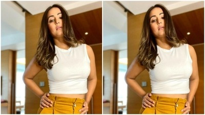 She teamed it with a contrasting pair of high-waisted ochre trousers. (Instagram/@realhinakhan) She teamed it with a contrasting pair of high-waisted ochre trousers. (Instagram/@realhinakhan)