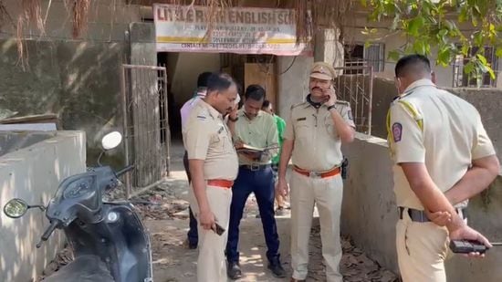 Police officers looking into the matter in which a 15-year-old Class 10 student was killed by his classmate as he went to resolve a quarrel in Thane on Tuesday. (PRAFUL GANGURDE/HT PHOTO)