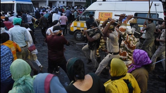 The protesting vocational teachers who were booked by Panchkula police were protesting to press for their demand for a wage hike and eight cops and at least 15 protesting teachers were injured in the ensuing clash. (Ht file)