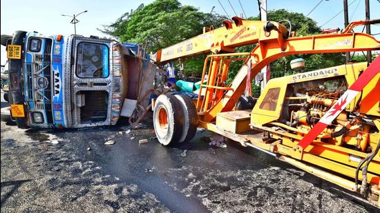 The overturned truck near Chand Cinema road in Ludhiana on Tuesday. (Gurpreet Singh/HT)
