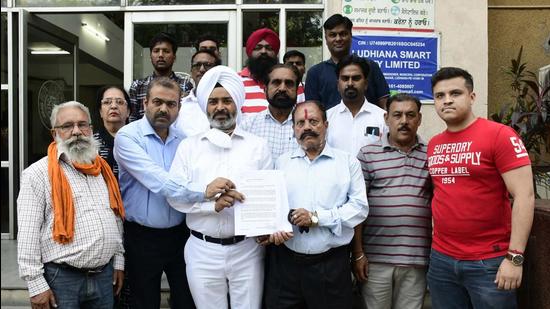 BJP leaders outside the MC’s Zone D office in Ludhiana on Tuesday. (Harsimar Pal Singh/HT)